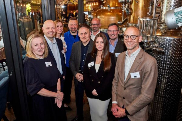 MLA Directors, men and women photographed at a bar in Manchester