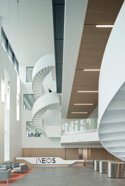 The reception area with high ceiling space showing white spiral staircase as the main centre piece.